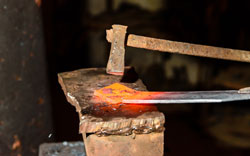 Cutting hot metal in the smithy