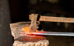 Cutting hot metal in the smithy