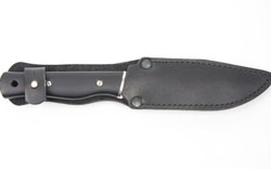 Knife for camping and hunting in a leather case on a white surface